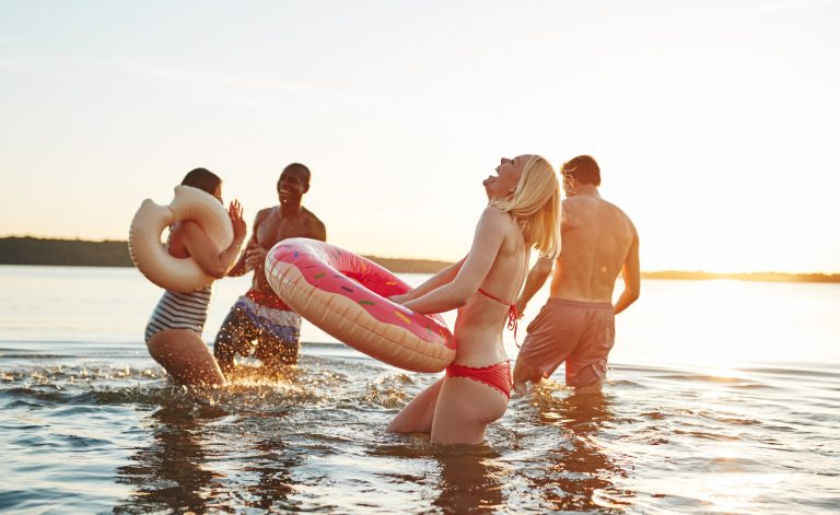 laughing friends standing boca grande sandbar